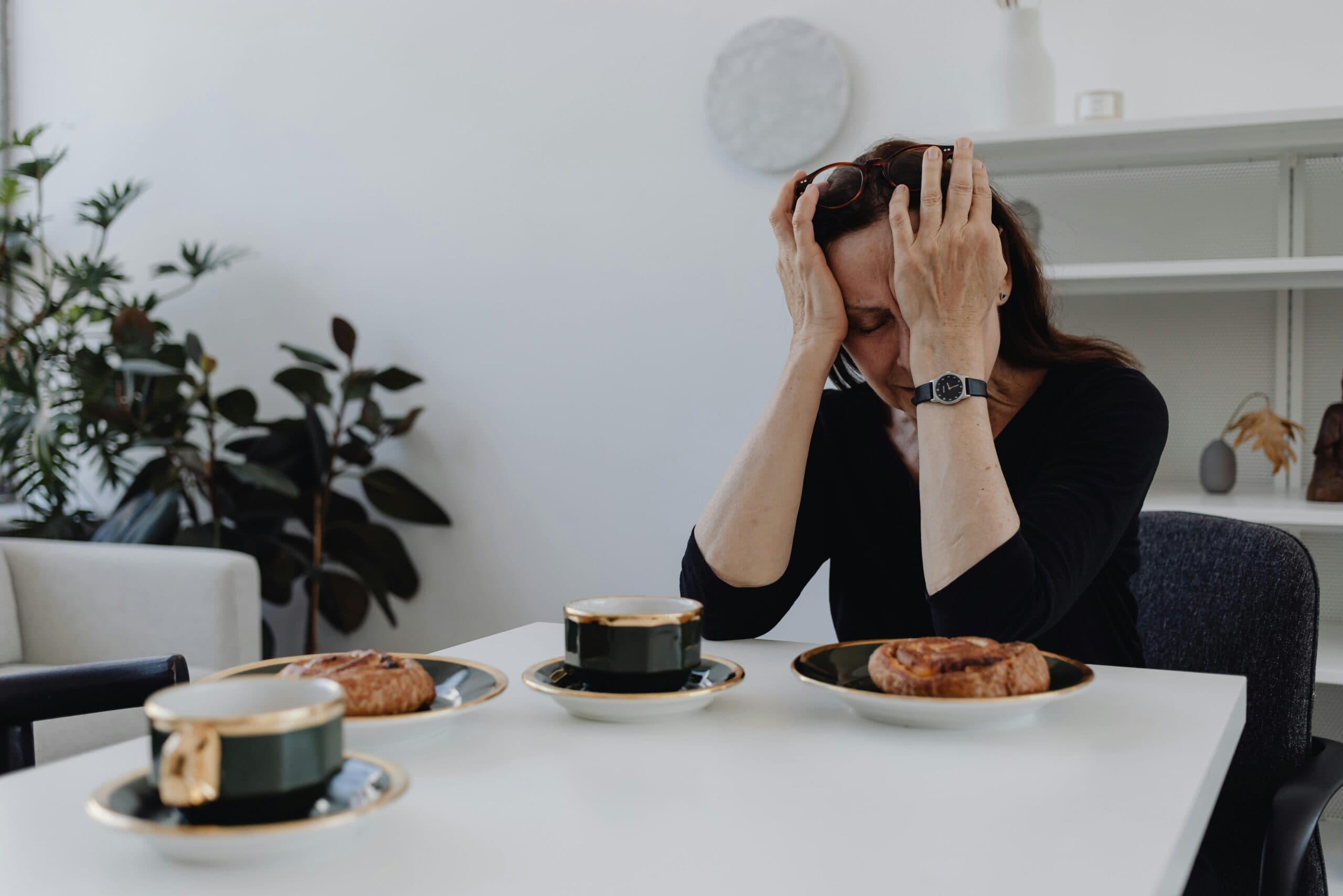 Person experiencing symptoms of an eating disorder in a quiet, reflective setting